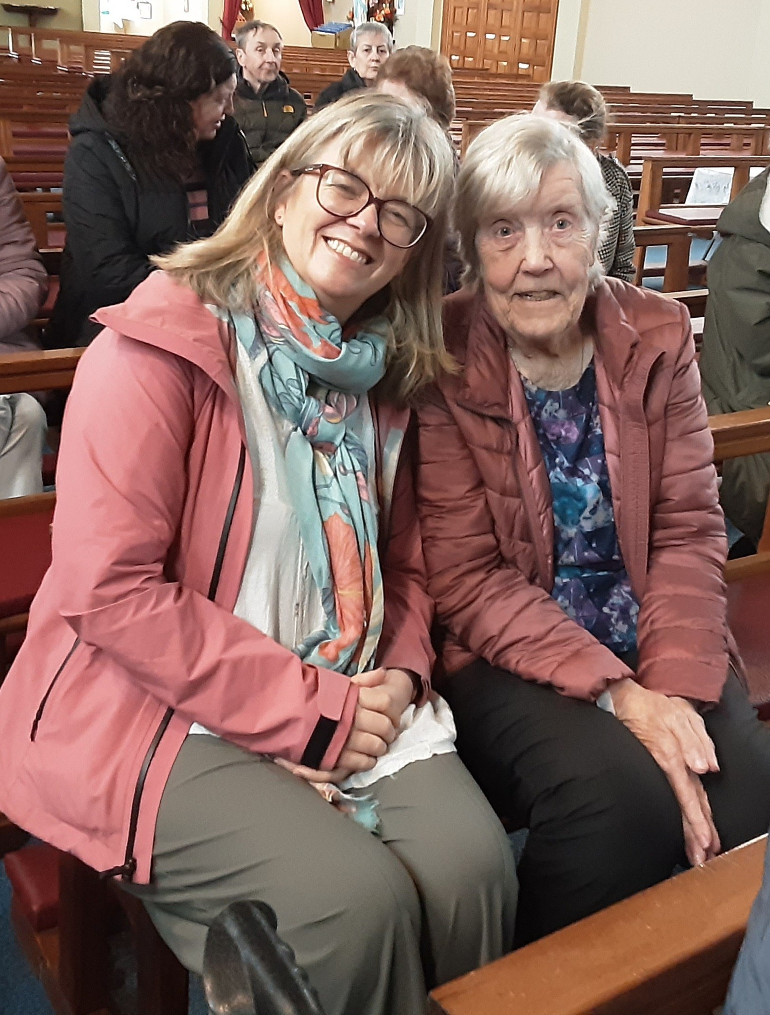 a volunteer at a church with a resident from Rathkeevan nursing home