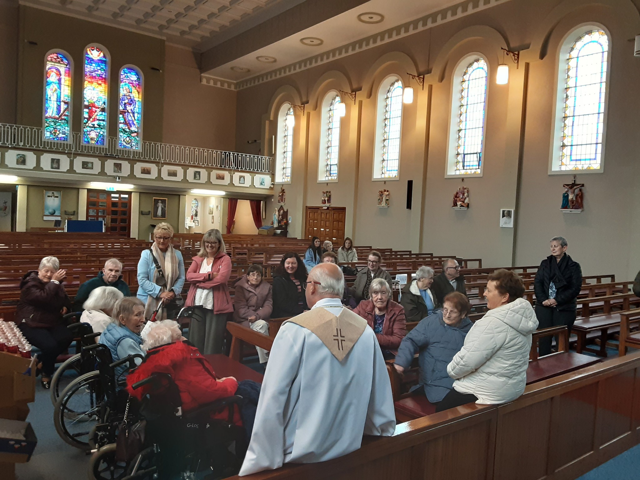 residents of the nursing home attending mass