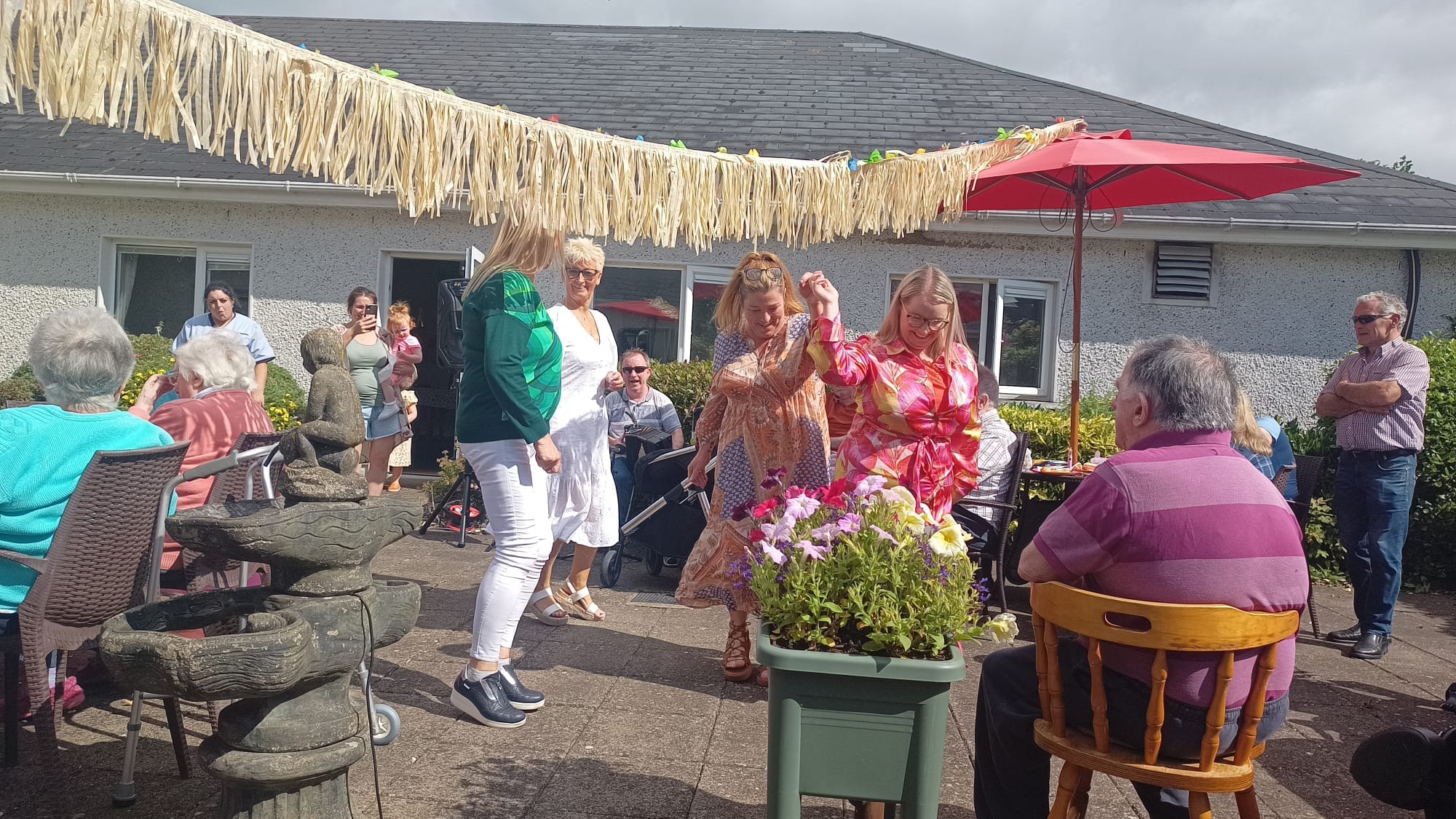 residents of the nursing home enjoying a party